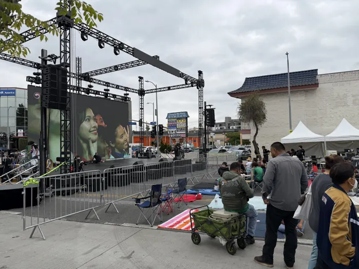 The giant LED screen and crowd at the Mexico vs Korea watch party